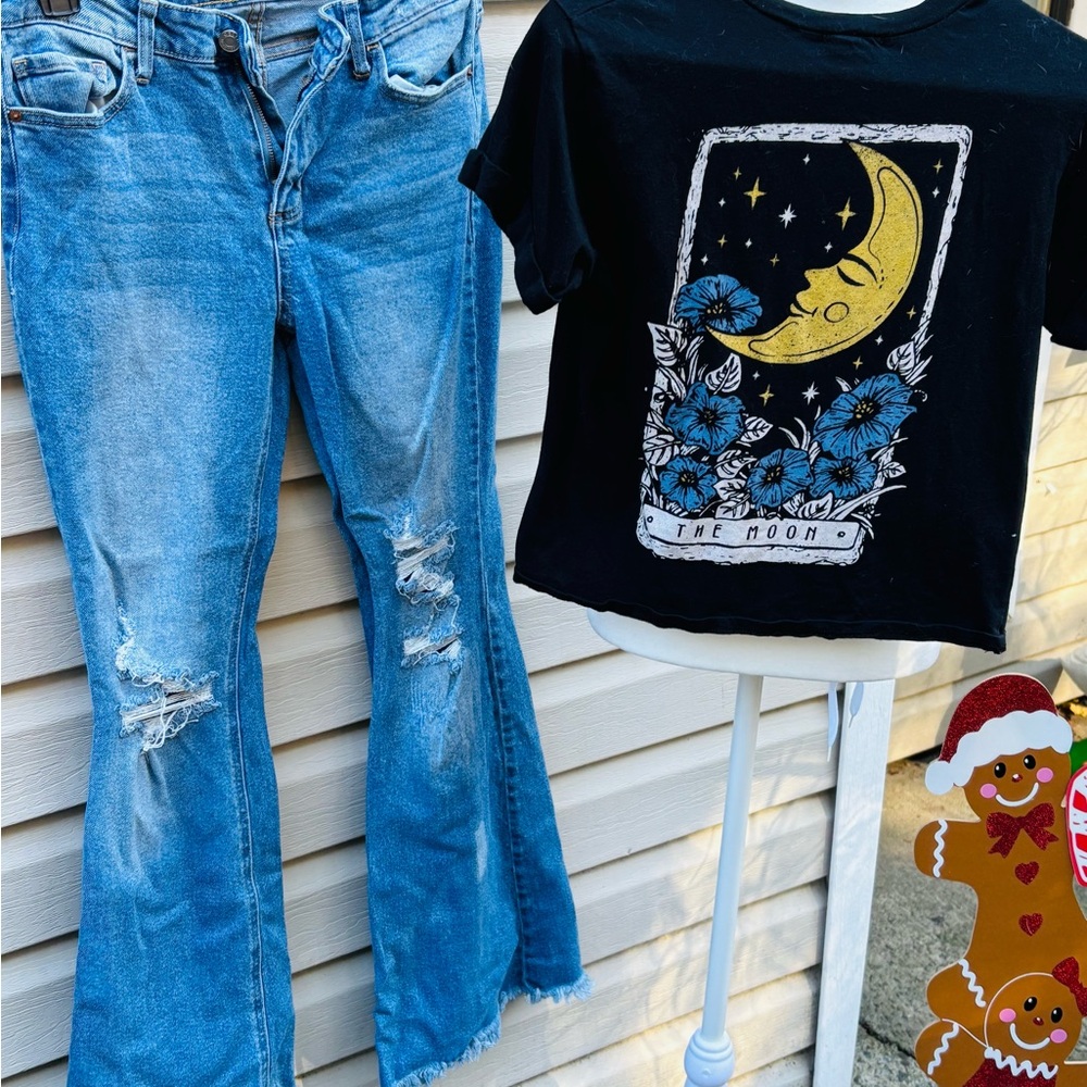 Black Graphic Tee and Distressed Blue Jeans